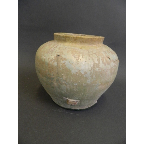 34 - A Chinese Tang Dynasty terracotta jar with an iridescent glaze, 6