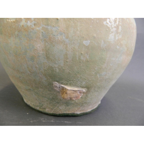 34 - A Chinese Tang Dynasty terracotta jar with an iridescent glaze, 6