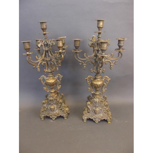 473 - A pair of ornate cast brass five branch candelabra, 19