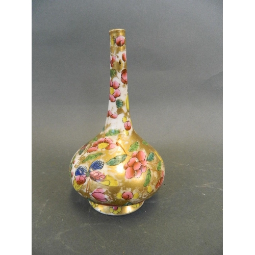 477 - A Persian porcelain long neck baluster specimen vase, signature to base, 5½