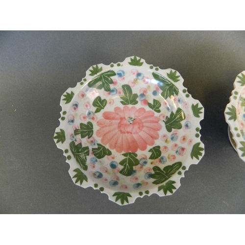 487 - A pair of Thai porcelain pedestal dishes with petal shaped rims and floral decoration, 5