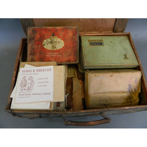 50V - A suitcase containing a quantity of gold and silver leaf including three full books of gold, and man... 