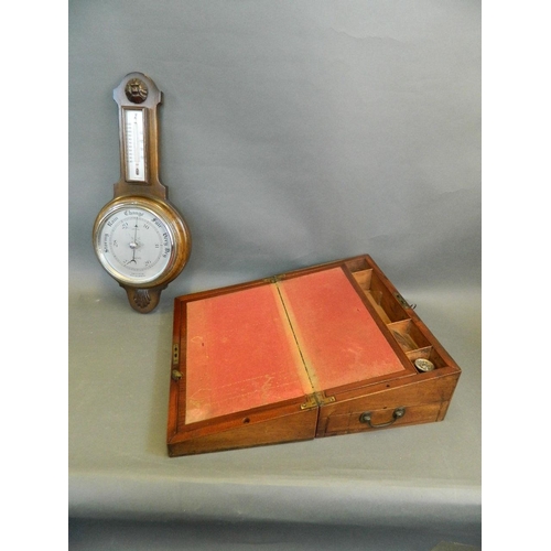 50W - A mahogany writing slope with fitted interior, together with an oak banjo barometer, 16