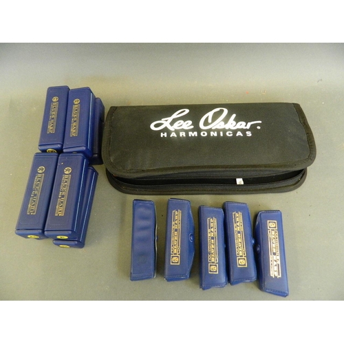 50Y - A full set of eight Hohner blues harmonicas, keys 'A, Ab, B, C, Db, E, F, G', in a Lee Oskar travel ... 