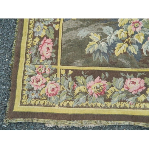 50Z - A Belgian tapestry wall hanging decorated with figures in a floral garden, after Angelika Kaufmann, ... 