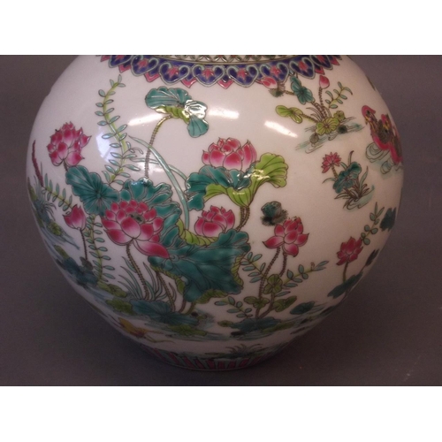 52 - A Chinese gourd shaped porcelain vase with lotus and bird decoration in bright enamels, 6 character ... 