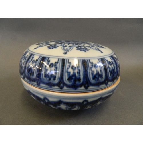 53 - A Chinese blue and white porcelain circular box, the lid decorated with Yin & Yang, 6 character mark... 