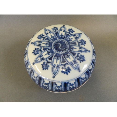 53 - A Chinese blue and white porcelain circular box, the lid decorated with Yin & Yang, 6 character mark... 