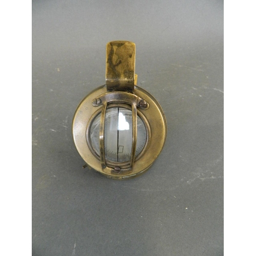 6 - A brass cased military sighting compass, marked 'T.G. & Co. Ltd, MK III', 2½