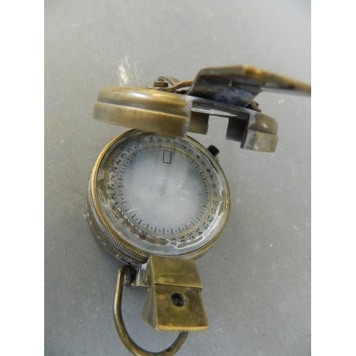 6 - A brass cased military sighting compass, marked 'T.G. & Co. Ltd, MK III', 2½