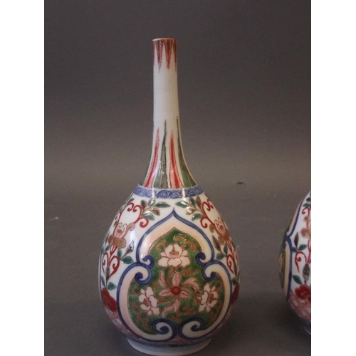 62 - A pair of C19th Oriental long necked porcelain vases with enamel decoration and gilt highlights, 9