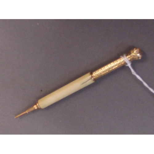 66 - A late C19th/early C20th gilt and ivory propelling pencil with engine turned body, patent 'March 21,... 