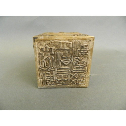 69 - A Chinese soapstone seal with carved kylin knop and decorative panels depicting mythical beasts, 5½