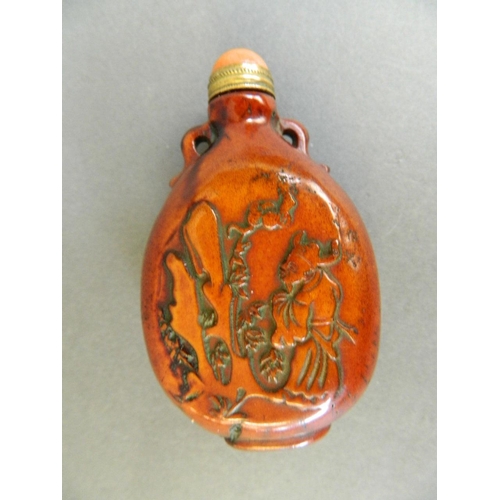 84 - A Chinese composition snuff bottle with embossed and carved decoration of sages, 3