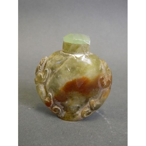 90 - A Chinese marbled hardstone snuff bottle with carved kylin decoration, 2