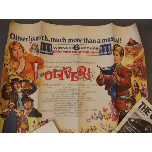 92 - An original 1969 quad film poster for 'Oliver!', a First Edition of 'The Cartoonist', together with ... 