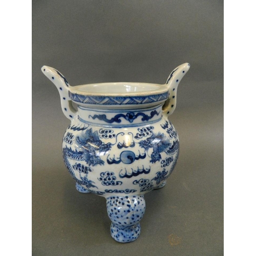 95 - A Chinese blue and white porcelain twin handled censer decorated with dragons chasing the flaming pe... 