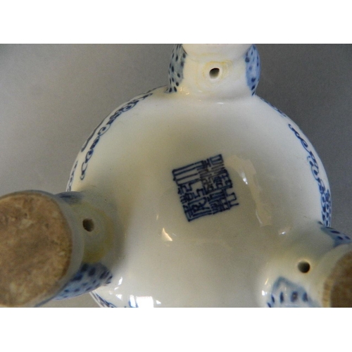 95 - A Chinese blue and white porcelain twin handled censer decorated with dragons chasing the flaming pe... 