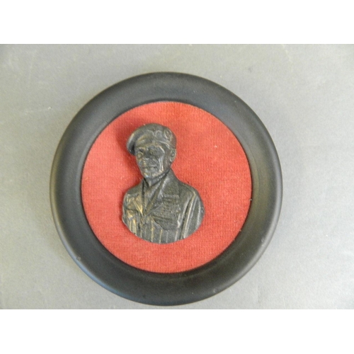 99 - A small bronzed profile plaque of Gen. Montgomery, in a circular frame, 4