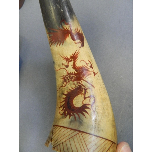 16 - A cow horn wall pocket with painted decoration of a red dragon, together with a collection of horn i... 