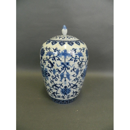 23 - A Chinese blue and white porcelain jar and cover decorated with lotus flowers, carp and bats, 11