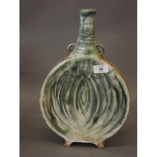 30 - A studio pottery flask, signed to base, and a green glazed vase with brass mounts, 15