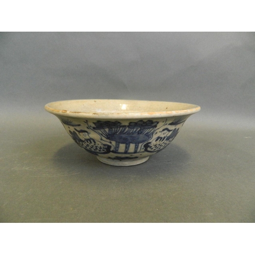 38 - An early Chinese blue and white porcelain rice bowl decorated with waterfowl in a lotus pond, 6½