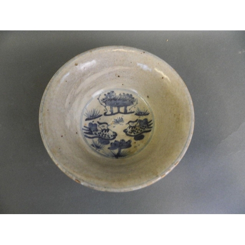 38 - An early Chinese blue and white porcelain rice bowl decorated with waterfowl in a lotus pond, 6½