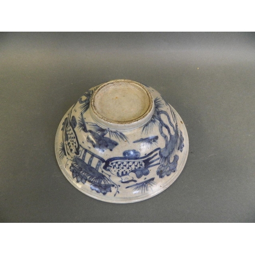 38 - An early Chinese blue and white porcelain rice bowl decorated with waterfowl in a lotus pond, 6½