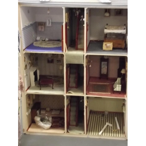 42 - A doll's house in the form of a Georgian town house with contents and lights (not tested), 29