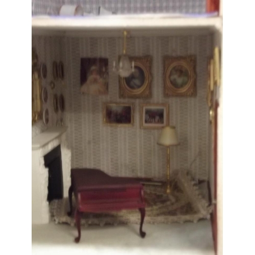 42 - A doll's house in the form of a Georgian town house with contents and lights (not tested), 29