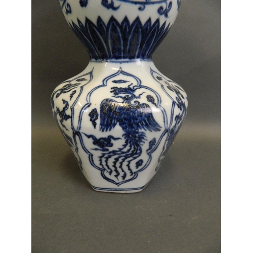 43 - A Chinese blue and white porcelain double gourd vase with octagonal shaped base and decorative panel... 