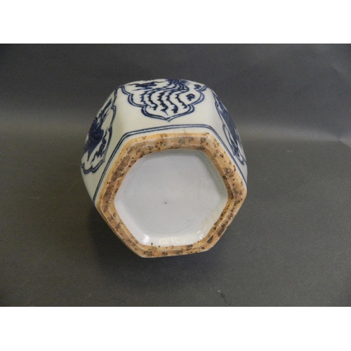 43 - A Chinese blue and white porcelain double gourd vase with octagonal shaped base and decorative panel... 