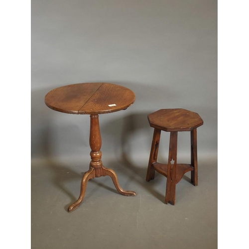 781 - A C19th oak tilt-top table raised on a turned column and tripod supports, (A/F) together with an Art... 