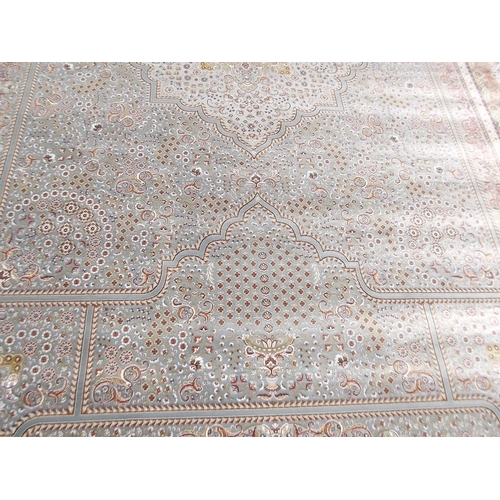 784 - A jade ground woven silk carpet with unique all over design, 79