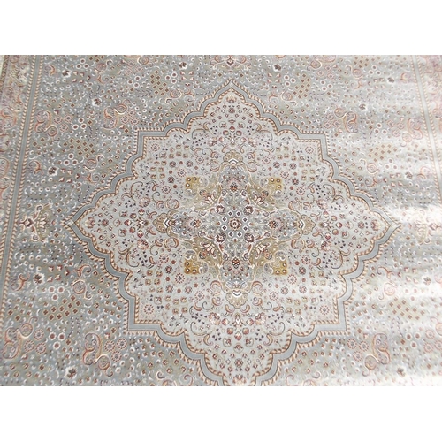 784 - A jade ground woven silk carpet with unique all over design, 79