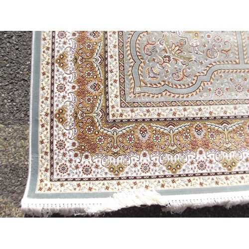 784 - A jade ground woven silk carpet with unique all over design, 79