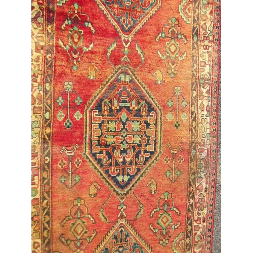 783 - An old red ground Persian Sarouk runner, signed and dated, 42