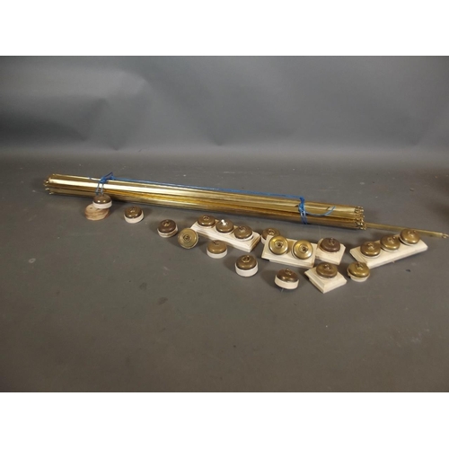 790 - A set of brass stair rods (26), together with a quantity of brass light switches, rods 42