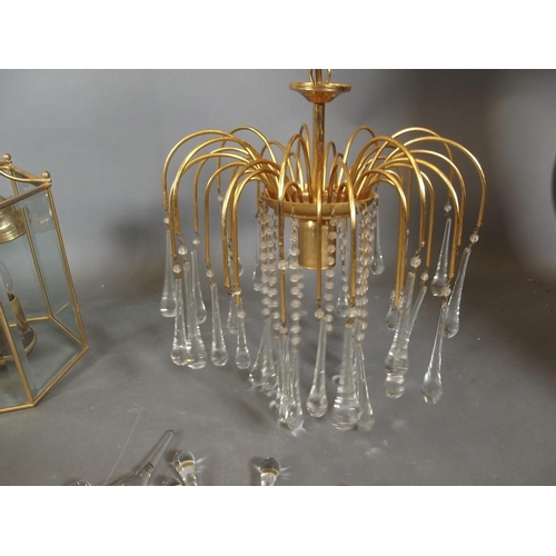 789 - A pair of John Lewis brass ceiling lanterns, a larger lantern and a crystal drop chandelier, largest... 