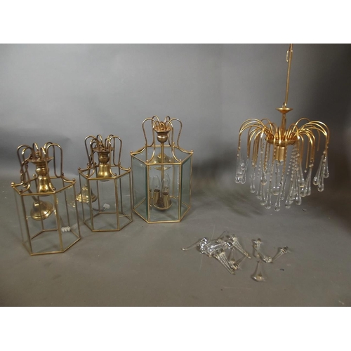 789 - A pair of John Lewis brass ceiling lanterns, a larger lantern and a crystal drop chandelier, largest... 