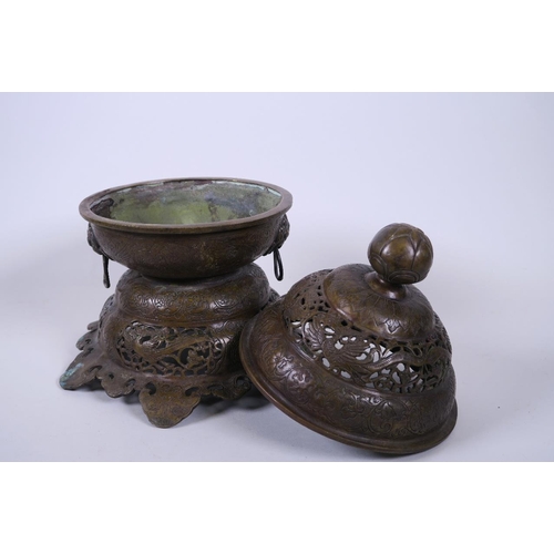 10 - A Chinese pierced bronze censer and lid with twin handles and phoenix decoration, 6 character mark t... 