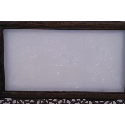 25 - A Chinese white jade and hardwood table screen with carved decoration of three immortals, 15