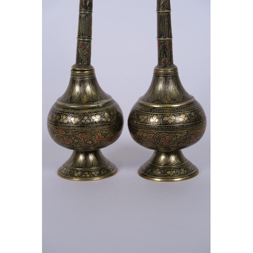 31 - A pair of Benares brass water sprinklers with engraved and enamelled decoration, 8