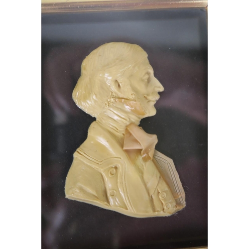 46 - A pair of framed wax portrait busts of a Regency lady and gentleman by Leslie Ray of London, 5½