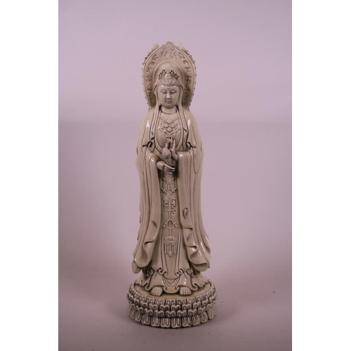 50B - A Chinese Blanc de Chine figure of Quan Yin in three manifestations, 16