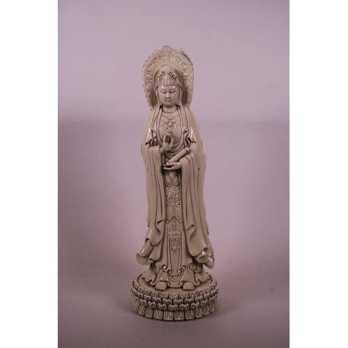 50B - A Chinese Blanc de Chine figure of Quan Yin in three manifestations, 16