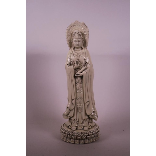 50B - A Chinese Blanc de Chine figure of Quan Yin in three manifestations, 16