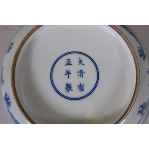 19 - A Chinese blue and white porcelain dish decorated with a dragon chasing the flaming pearl, 6 charact... 