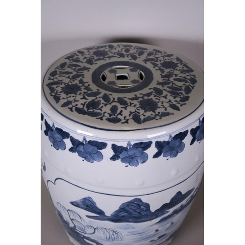 20 - A Chinese blue and white pottery garden seat decorated with a lake landscape, 17½